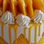 Astuta cake with Mango toppings and Sauce