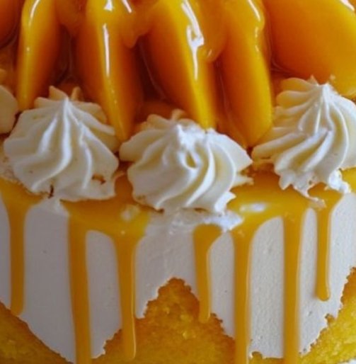 Astuta cake with Mango toppings and Sauce